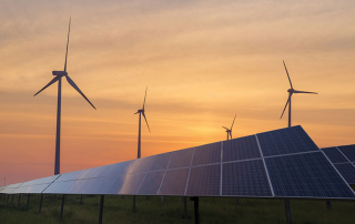 Solar Panels and Wind Turbines at sundown